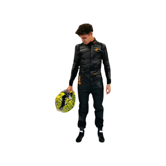 F1 Go Kart  Lando Norris 2025 McLaren race suit Person wearing a black racing suit holding a helmet with a white background