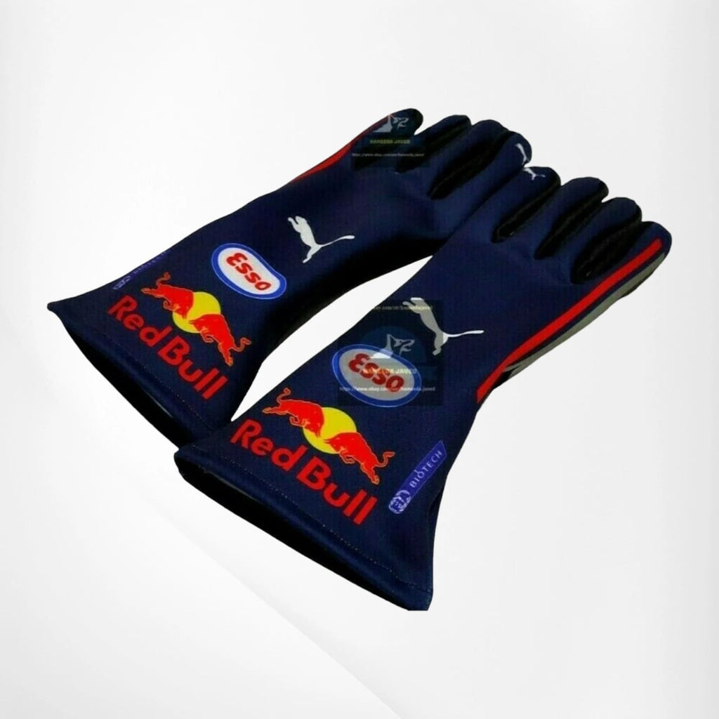 Pair of blue racing gloves with Red Bull and Puma logos on a white background