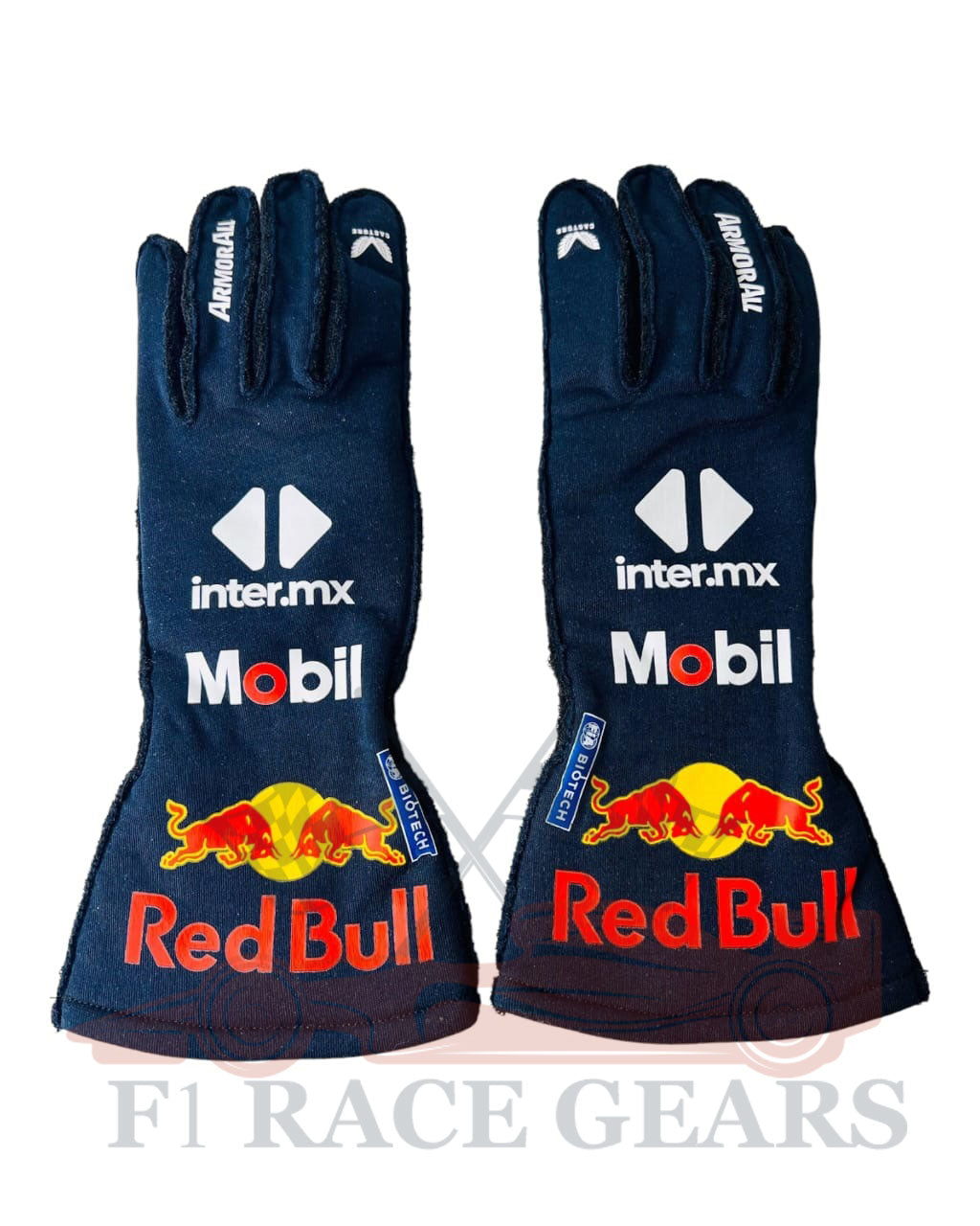 Pair of navy blue racing gloves with Red Bull and inter.mx branding on a white background.