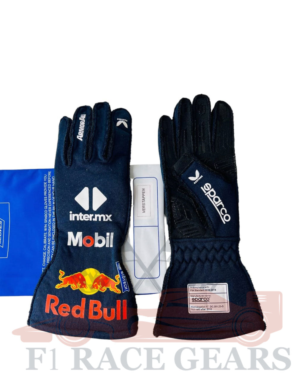 Black racing gloves with Red Bull and inter mx branding on a white background