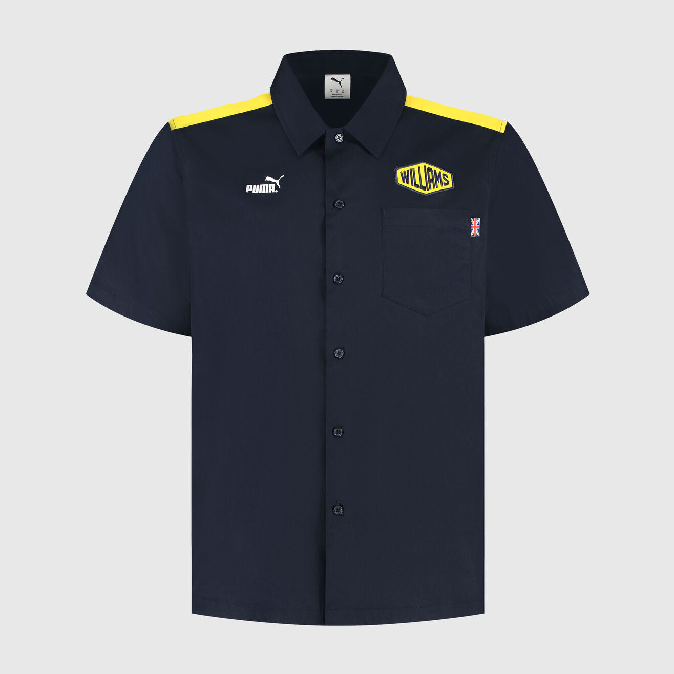 Navy shirt with yellow accents and Puma logo on a light gray background